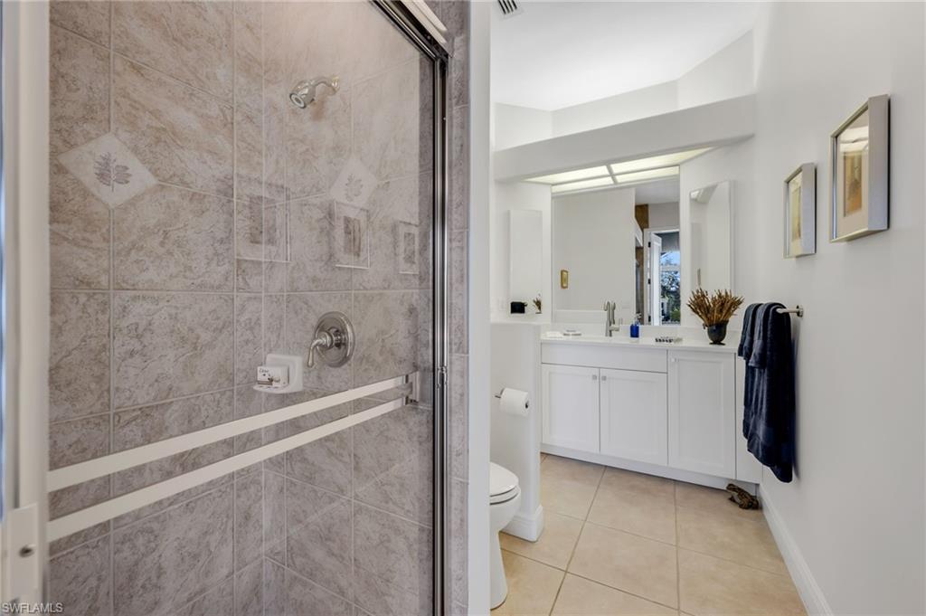 20001 Chapel Trace Estero, FL 33928 - Photo 20 of 32 a bathroom with a sink a toilet and shower