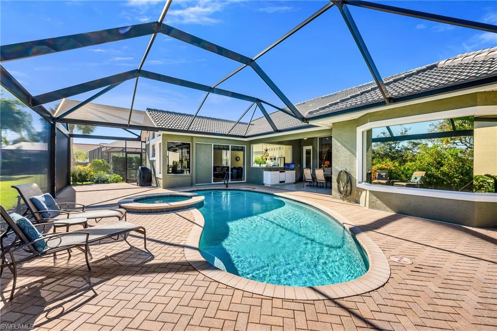 20001 Chapel Trace Estero, FL 33928 - Photo 2 of 32 a view of a swimming pool with a patio