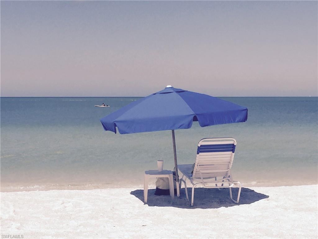 20001 Chapel Trace Estero, FL 33928 - Photo 24 of 32 a dining room with table chairs and wooden floor