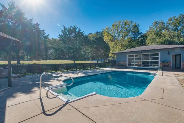 a bathroom with a double vanity sink and mirror