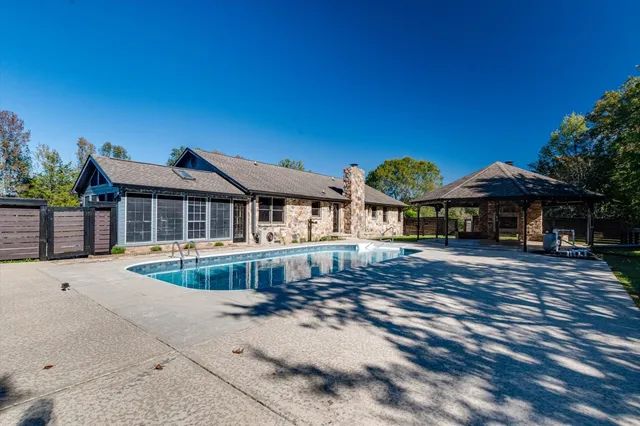 a bathroom with a toilet a sink and a mirror