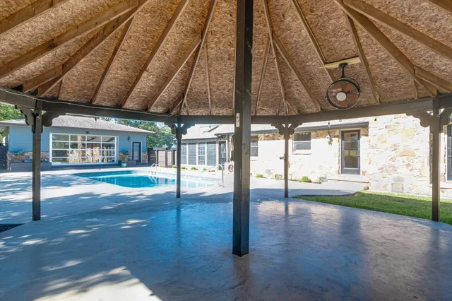 a view of swimming pool and mountain in the back