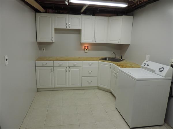 7 Haskell Road Pepperell, MA 01463 - Photo 15 of 25 a utility room with sink dryer and washer