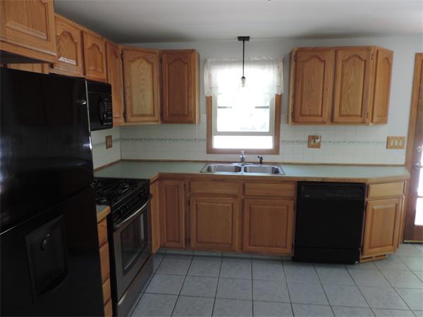 7 Haskell Road Pepperell, MA 01463 - Photo 17 of 25 a kitchen with granite countertop a cabinets and steel stainless steel appliances