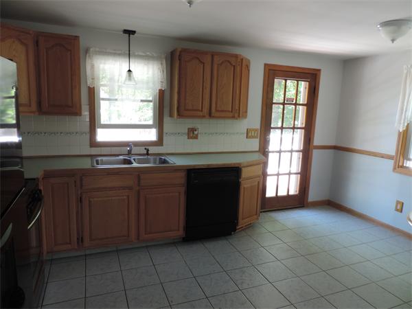 7 Haskell Road Pepperell, MA 01463 - Photo 18 of 25 a kitchen with granite countertop a sink cabinets and window