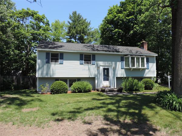 7 Haskell Road Pepperell, MA 01463 - Photo 2 of 25 a front view of a house with a yard