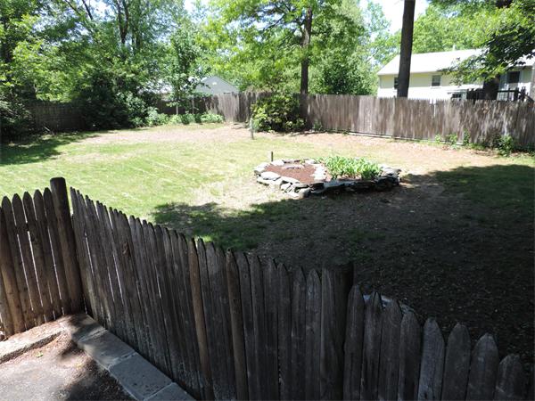 7 Haskell Road Pepperell, MA 01463 - Photo 22 of 25 a view of a backyard with wooden fence