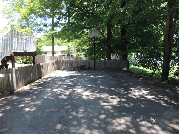 7 Haskell Road Pepperell, MA 01463 - Photo 24 of 25 a backyard of a house with lots of green space