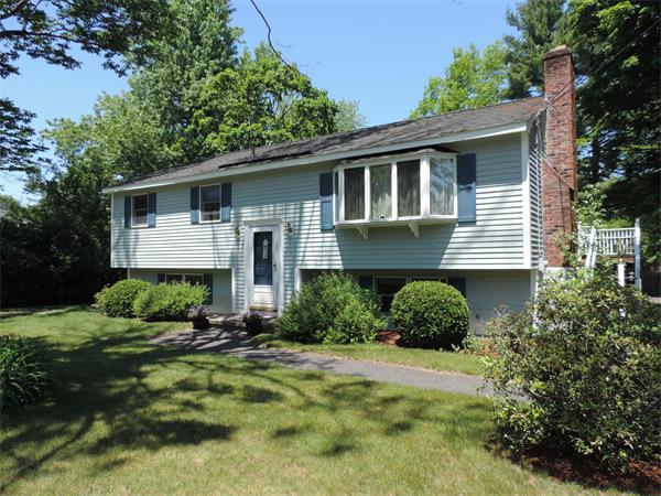 7 Haskell Road Pepperell, MA 01463 - Photo 3 of 25 a front view of a house with a yard