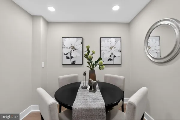 a living room with furniture and kitchen view