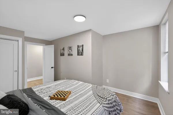 a view of room with window and wooden floor