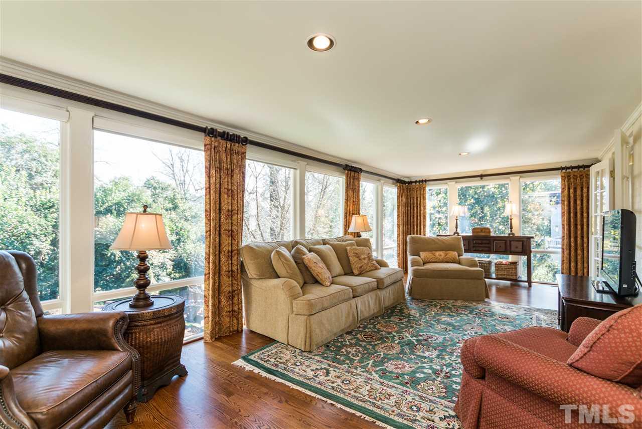 1422 Canterbury Road Raleigh, NC 27608 - Photo 12 of 25 a living room with furniture and a large window