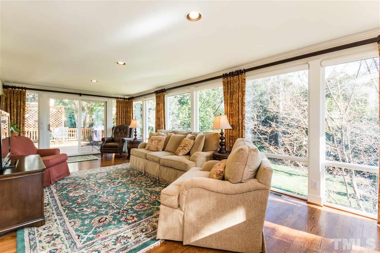 1422 Canterbury Road Raleigh, NC 27608 - Photo 14 of 25 a living room with furniture and a large window