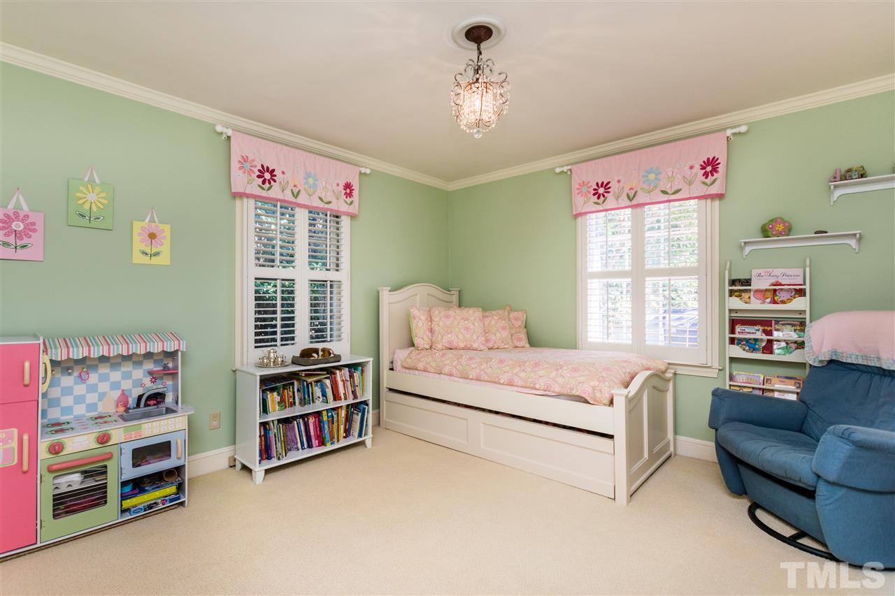 1422 Canterbury Road Raleigh, NC 27608 - Photo 19 of 25 a bedroom with furniture and a large window