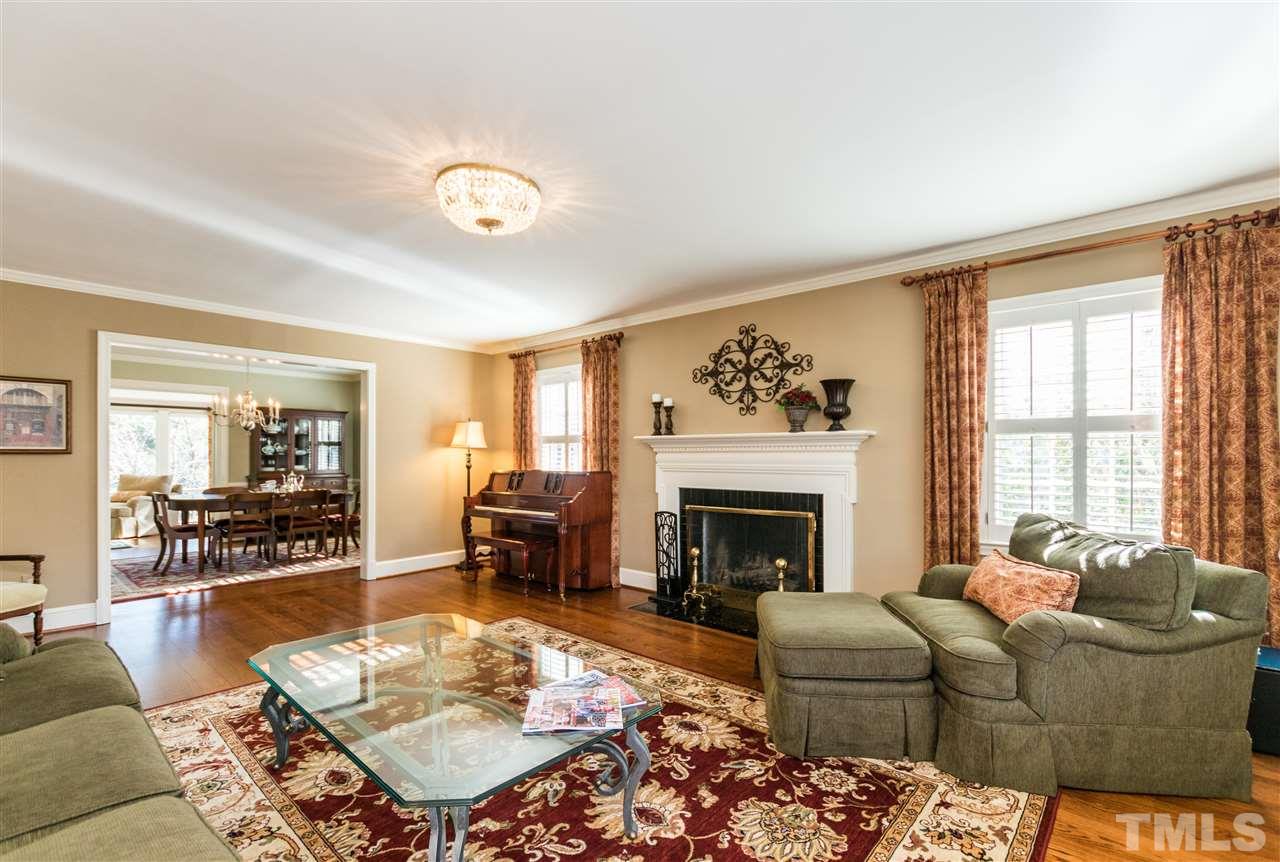 1422 Canterbury Road Raleigh, NC 27608 - Photo 4 of 25 a living room with furniture and a fireplace