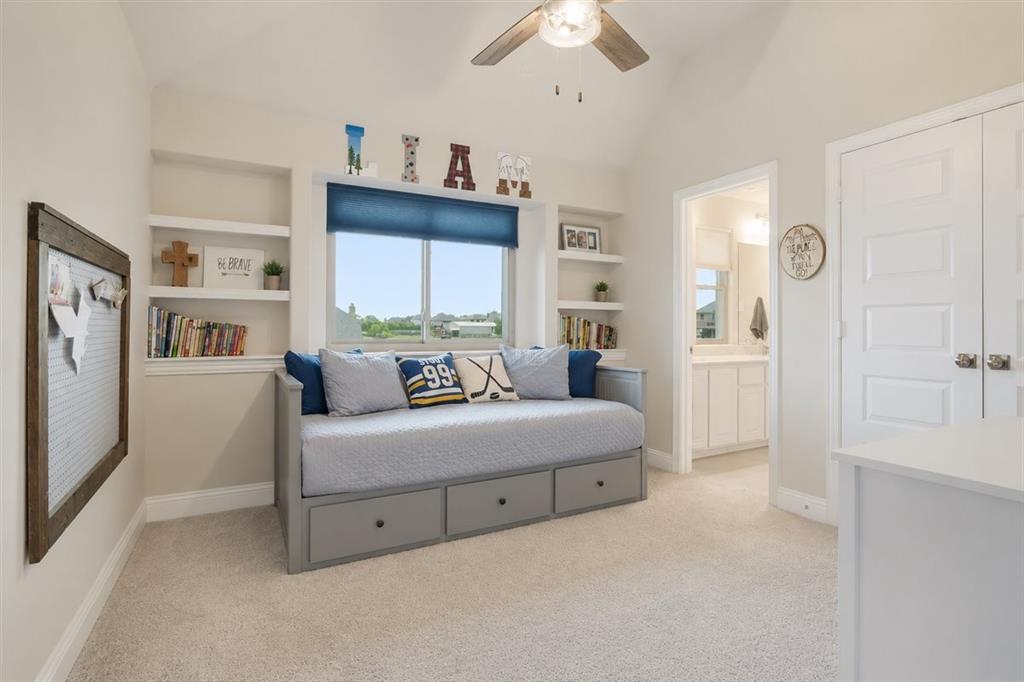 1205 Redbud Street Howe, TX 75459 - Photo 23 of 40 a bedroom with a bed and a window