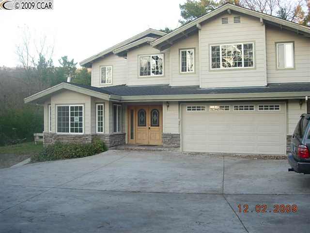 1112 North Thompson Road Lafayette, CA 94549 - Photo 1 of 1 a front view of a house with garage
