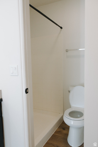 215 South 1050th West, Unit 10 Provo, UT 84601 - Photo 23 of 38 Bathroom featuring a shower stall and dark wood-style floors