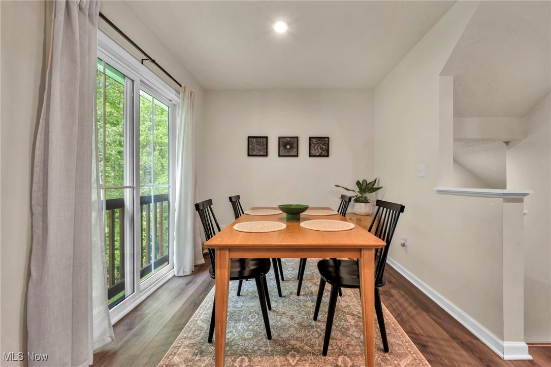 191 Raintree Lane Painesville, OH 44077 - Photo 10 of 35 Dining area featuring baseboards and dark wood-style floors