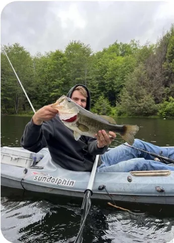 a view of a balcony with two chairs and a table