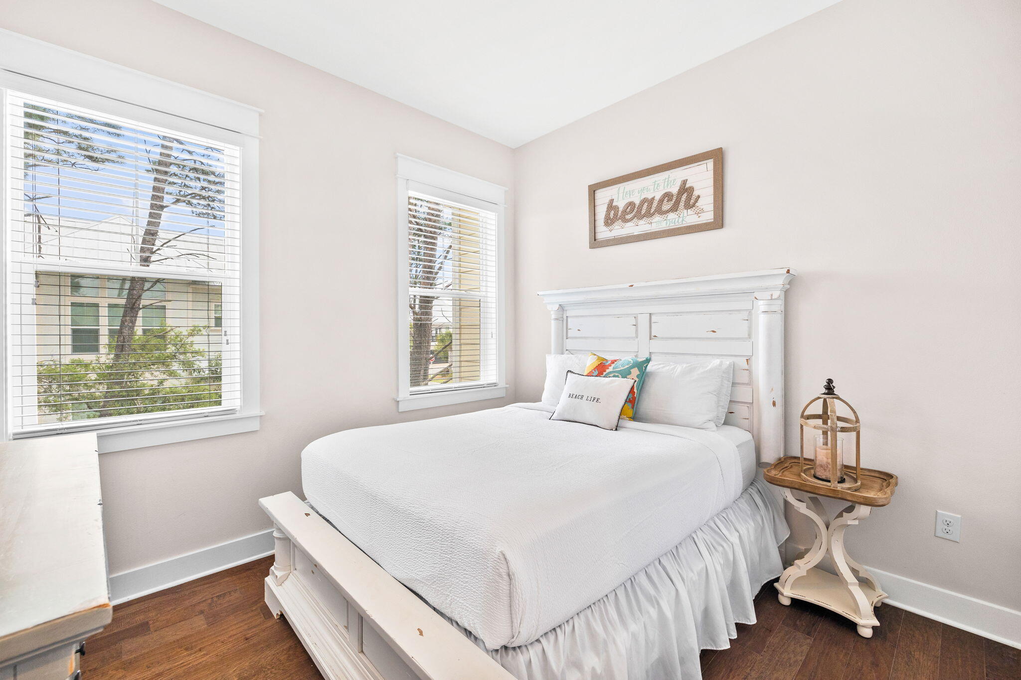 34 Pine Lands Loop Inlet Beach, Unit B Inlet Beach, FL 32461 - Photo 13 of 33 a bedroom with a bed and wooden floor