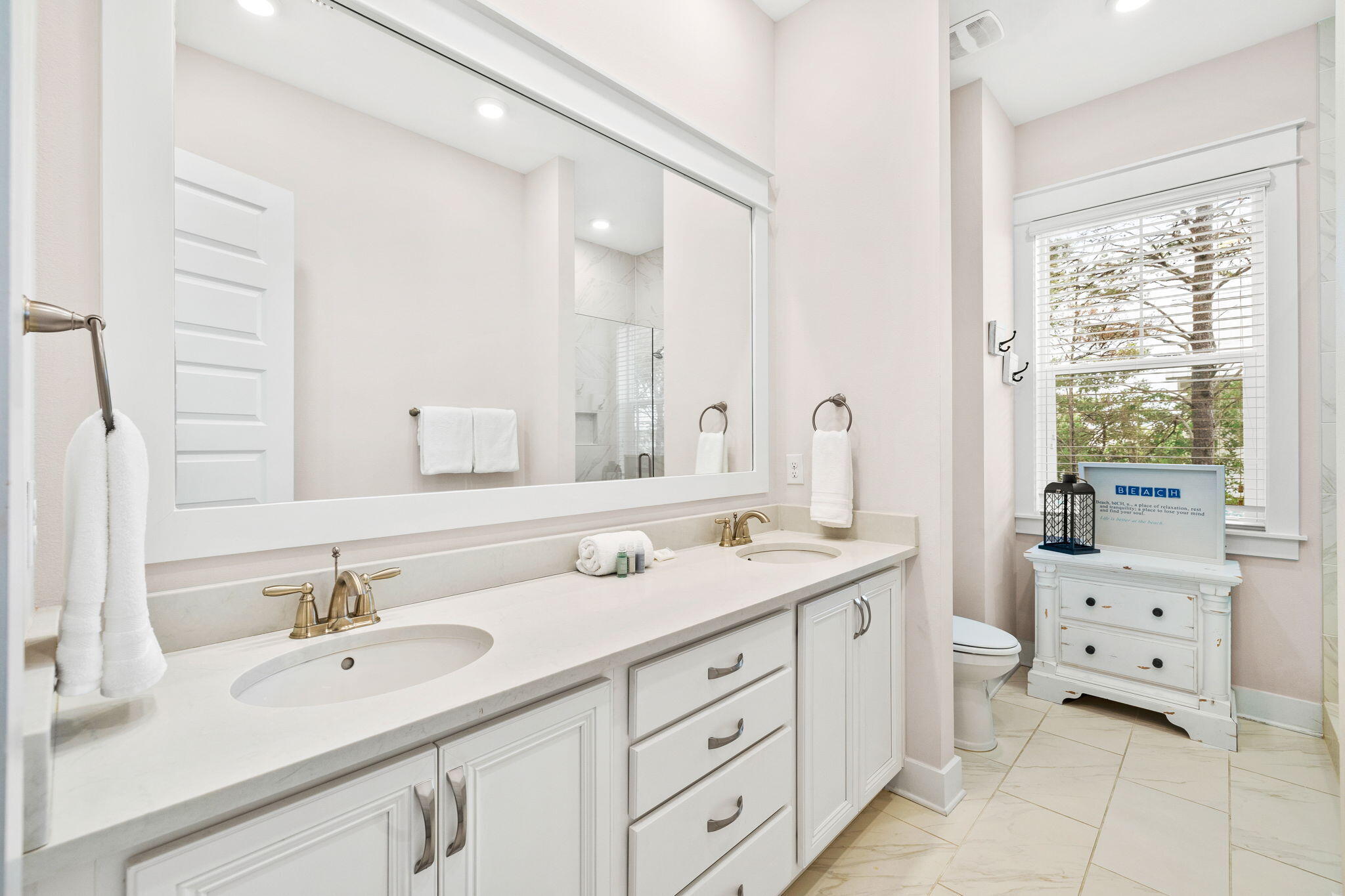 34 Pine Lands Loop Inlet Beach, Unit B Inlet Beach, FL 32461 - Photo 17 of 33 a bathroom with a sink double vanity sink and a mirror