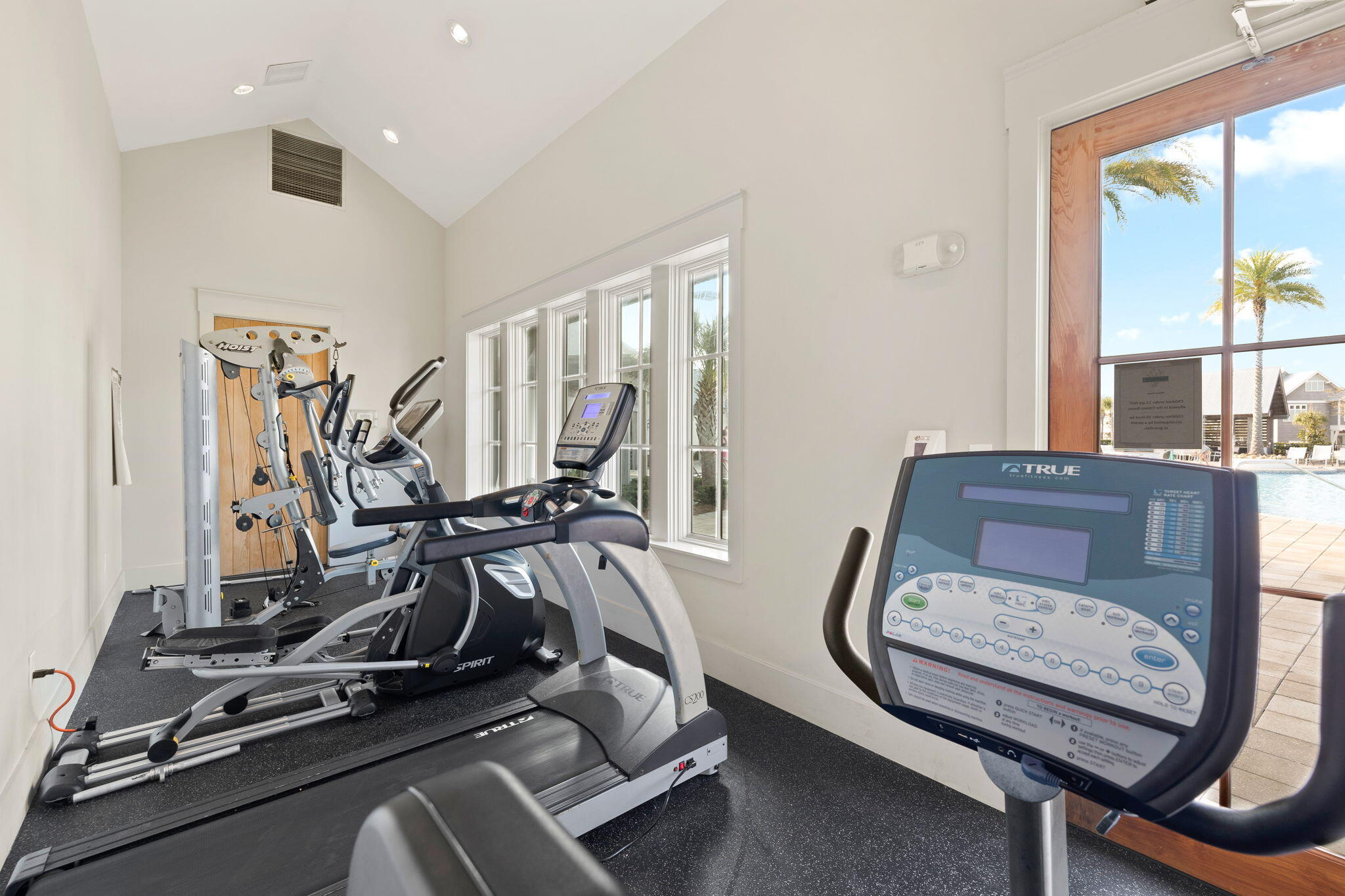 34 Pine Lands Loop Inlet Beach, Unit B Inlet Beach, FL 32461 - Photo 25 of 33 a room with gym equipment and windows