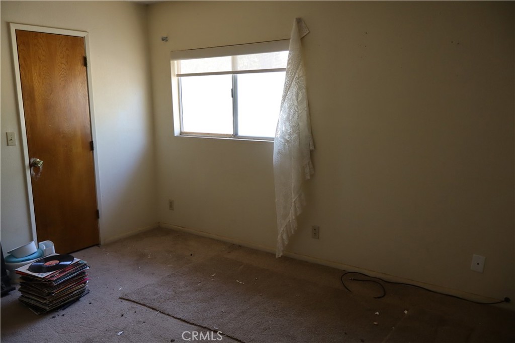 47150 Black Butte Road Newberry Springs, CA 92365 - Photo 18 of 27 an empty room with a window