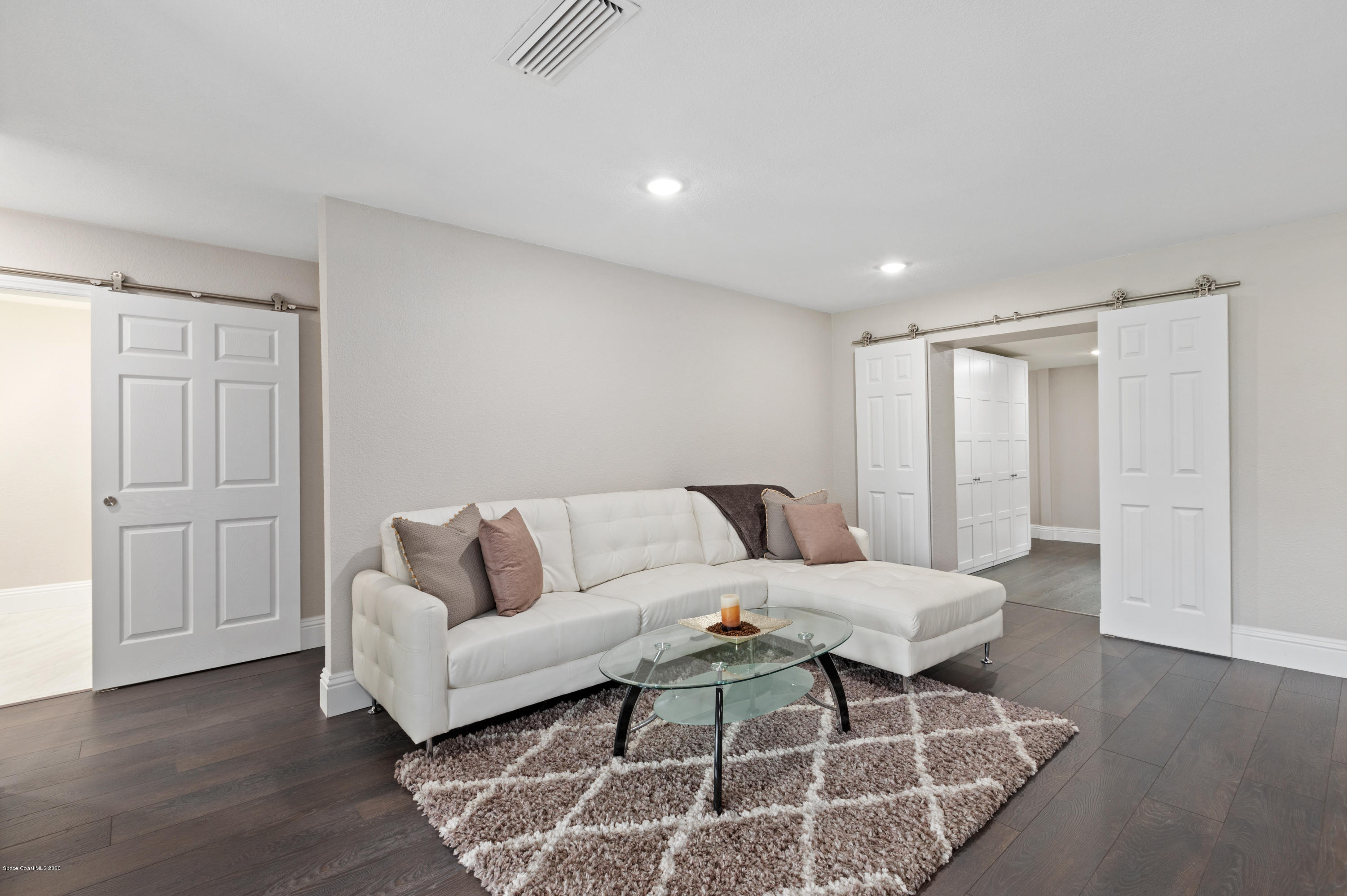 1790 Harlock Road Melbourne, FL 32934 - Photo 14 of 47 a living room with furniture and wooden floor