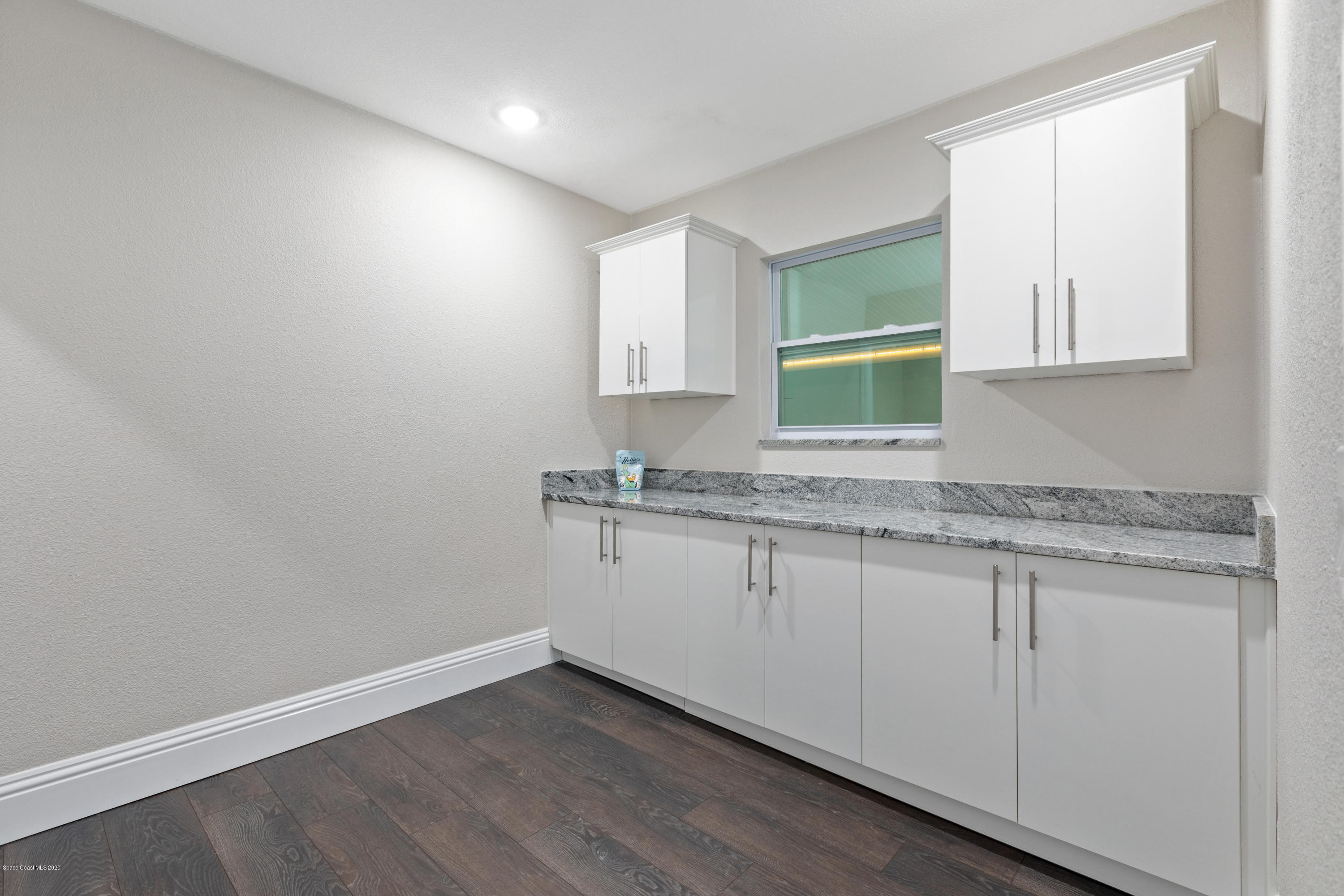 1790 Harlock Road Melbourne, FL 32934 - Photo 17 of 47 a bathroom with a granite countertop sink and a vanity