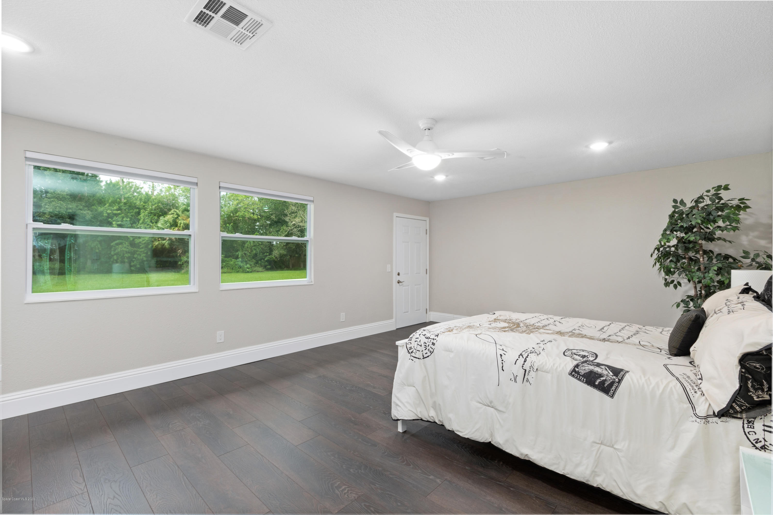 1790 Harlock Road Melbourne, FL 32934 - Photo 20 of 47 a bedroom with a bed and a window
