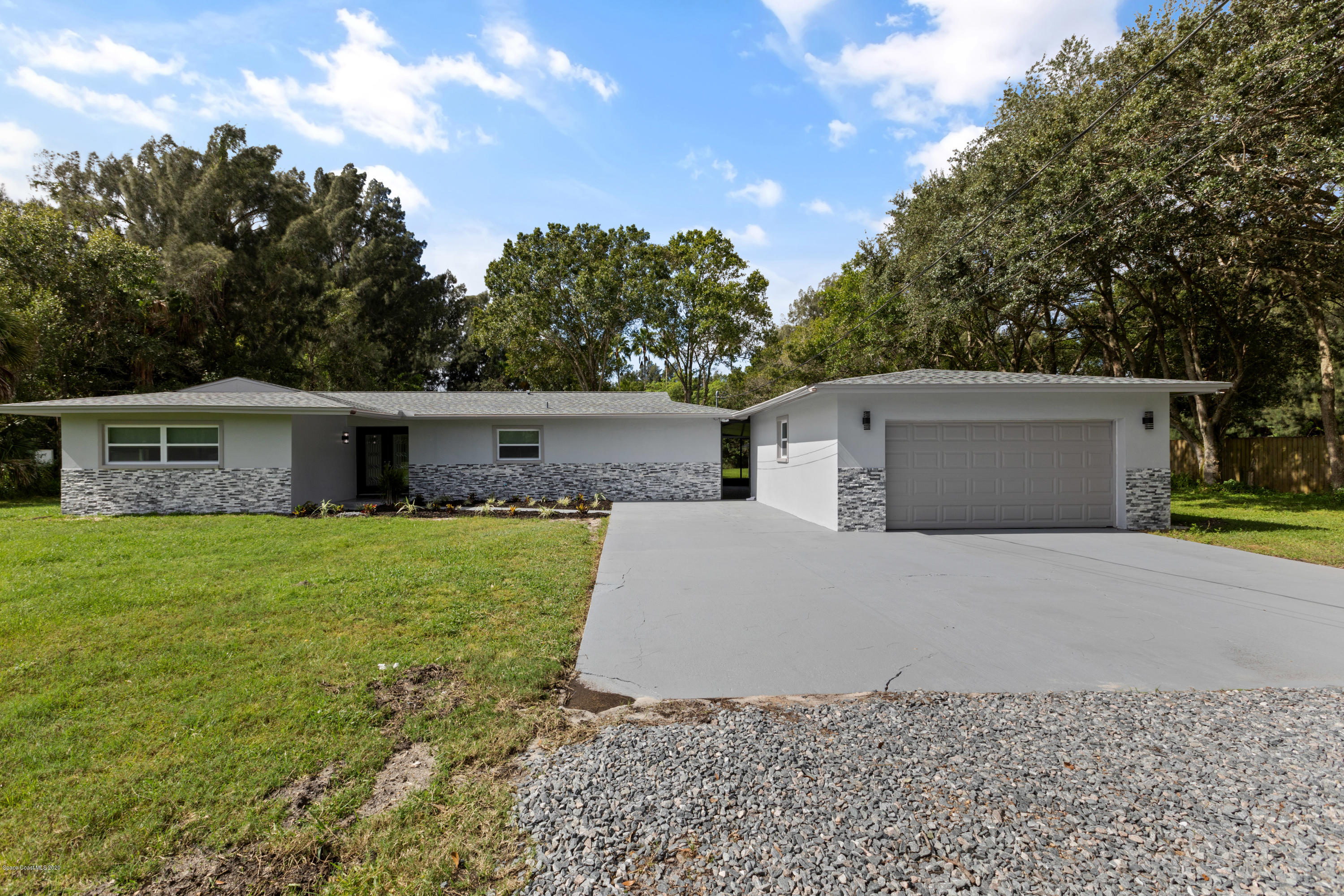 1790 Harlock Road Melbourne, FL 32934 - Photo 3 of 47 a front view of house with a garden