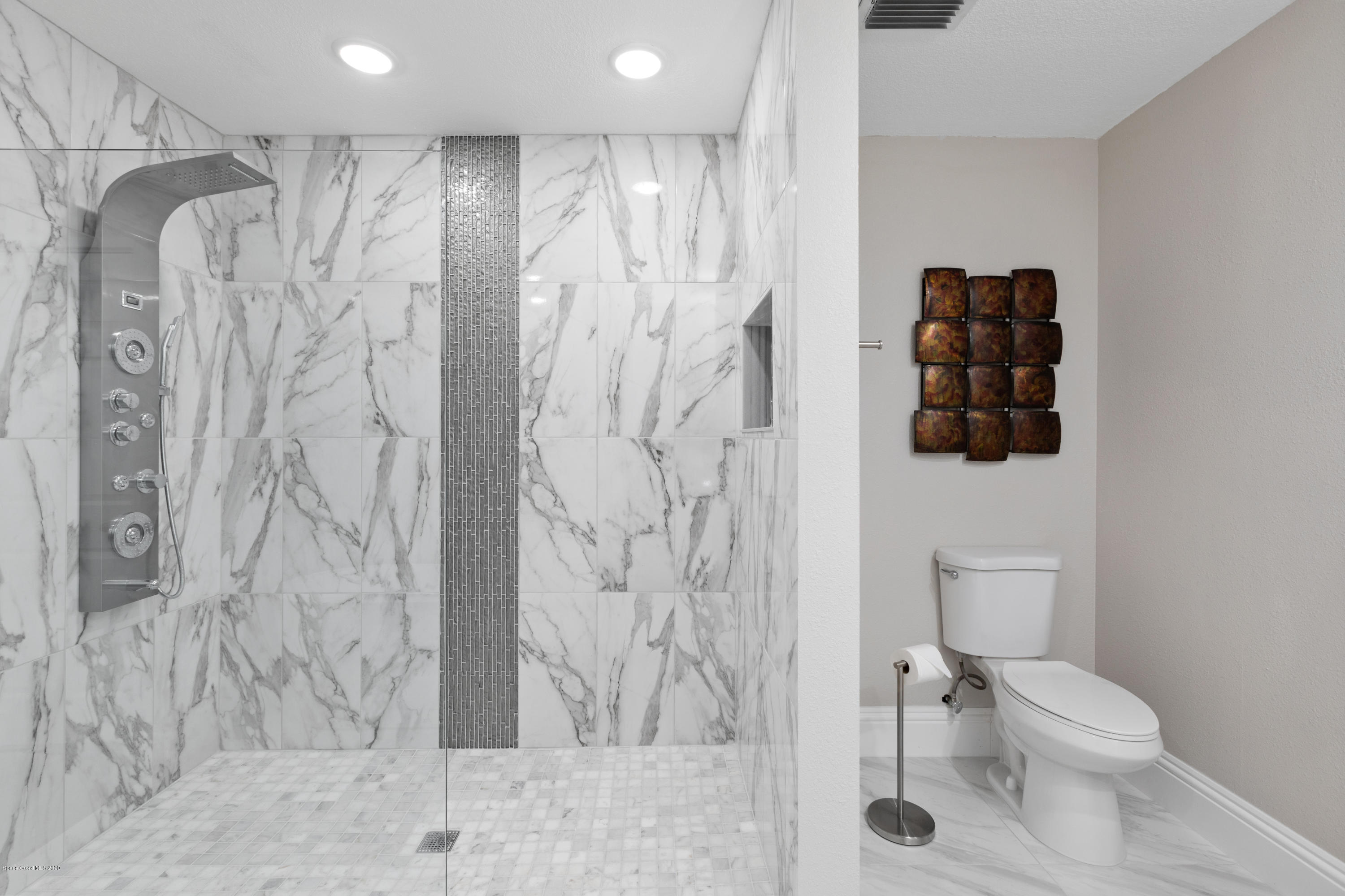 1790 Harlock Road Melbourne, FL 32934 - Photo 22 of 47 a bathroom with a toilet sink and shower
