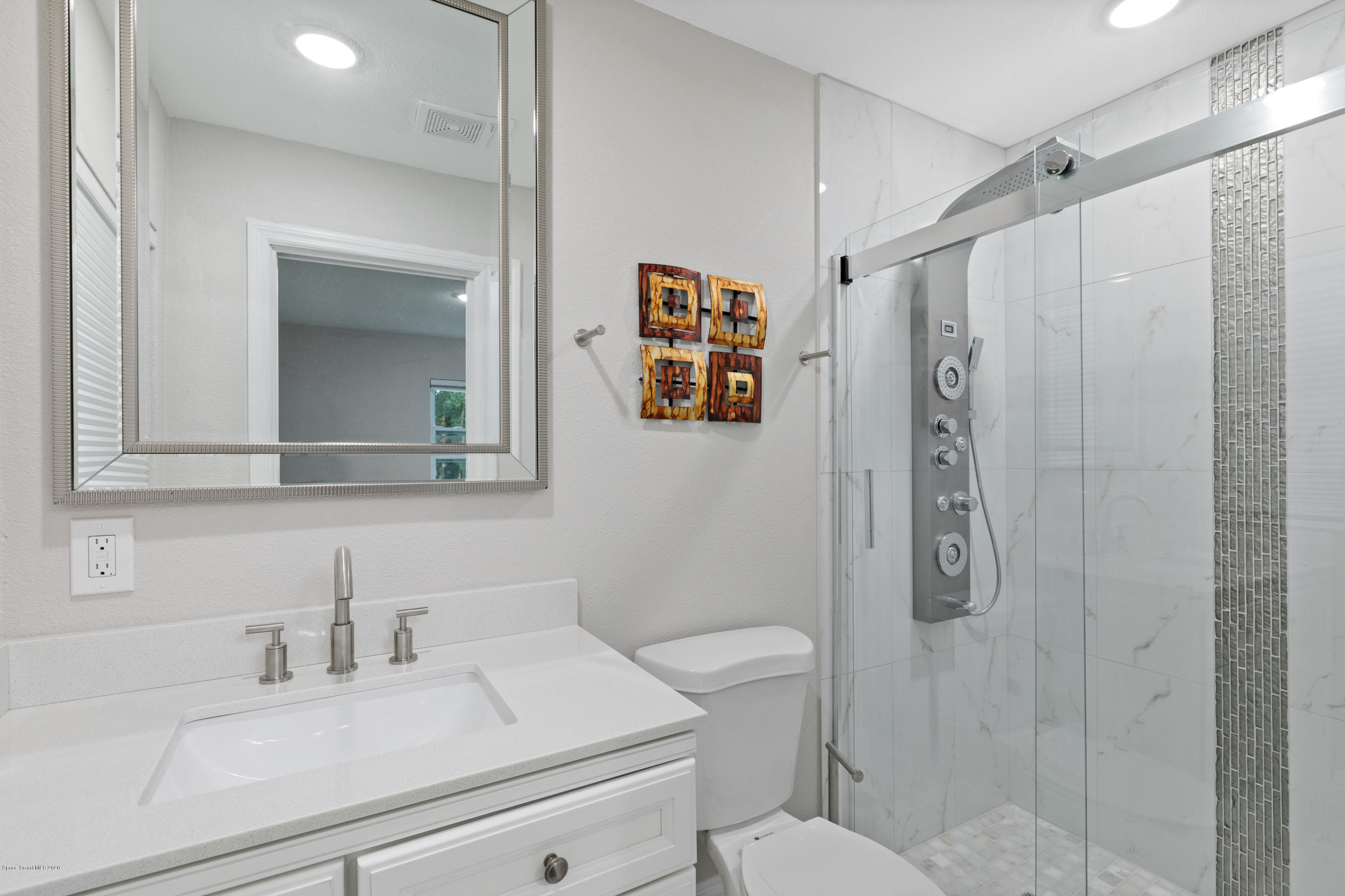 1790 Harlock Road Melbourne, FL 32934 - Photo 28 of 47 a bathroom with a sink a toilet and shower