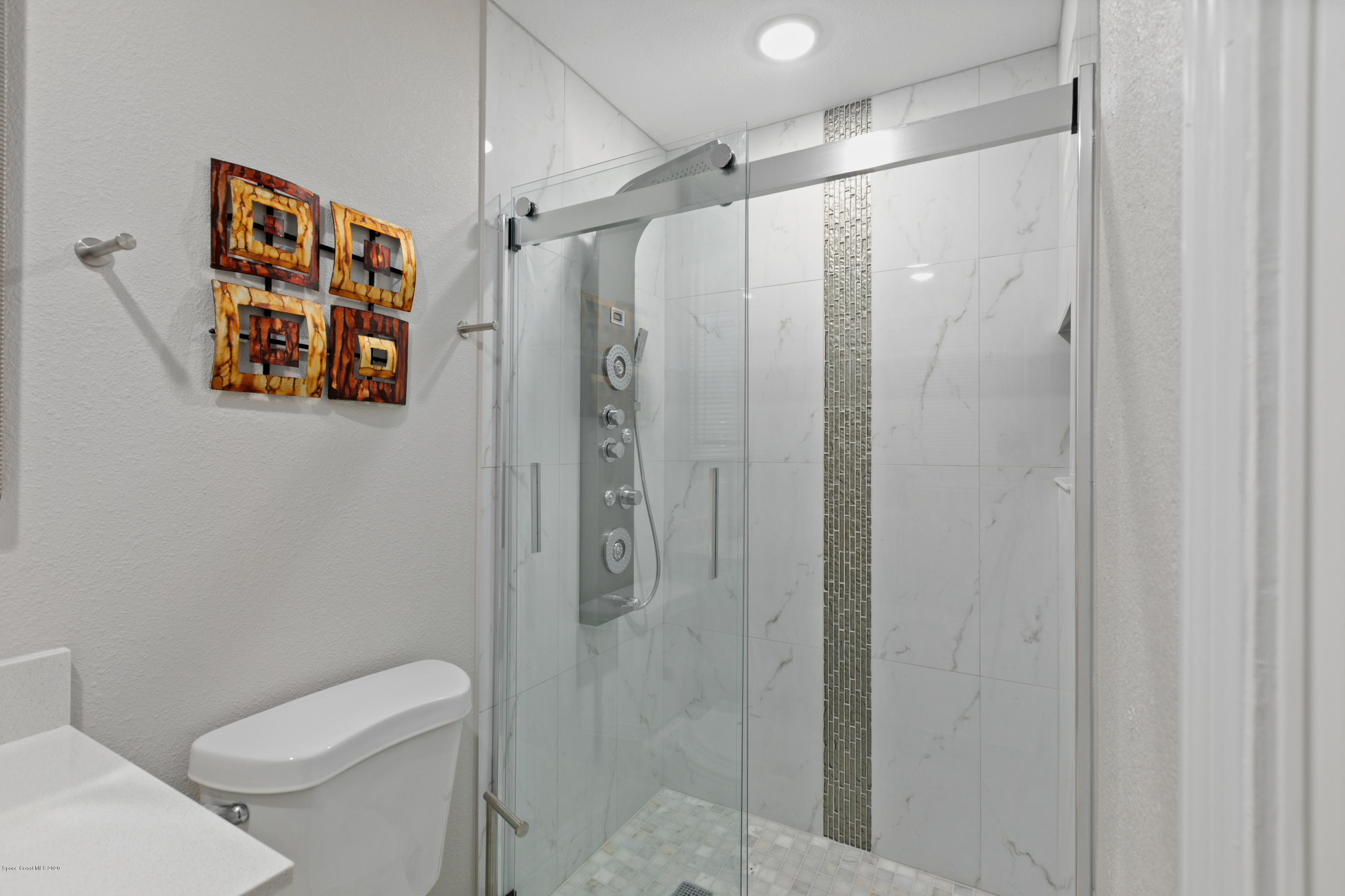 1790 Harlock Road Melbourne, FL 32934 - Photo 29 of 47 a bathroom with a shower and toilet