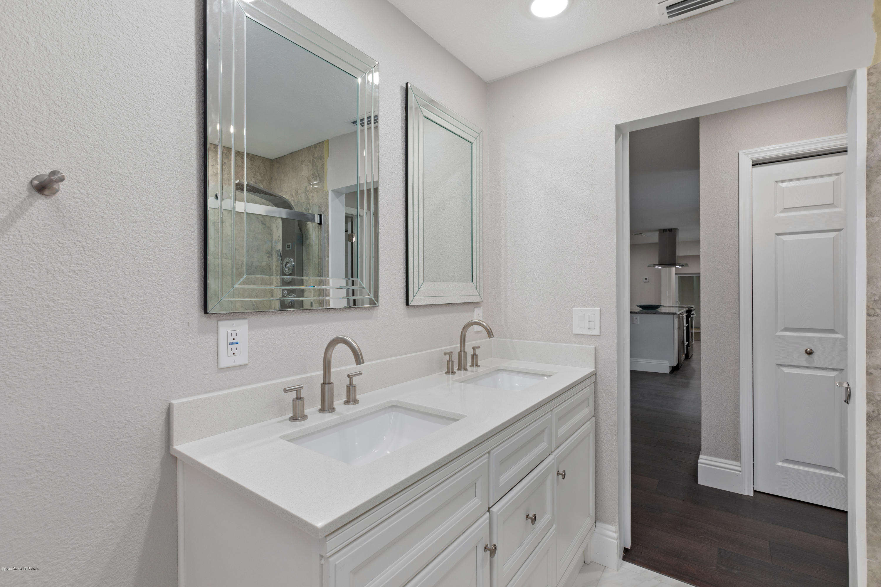 1790 Harlock Road Melbourne, FL 32934 - Photo 31 of 47 a bathroom with a sink and a mirror
