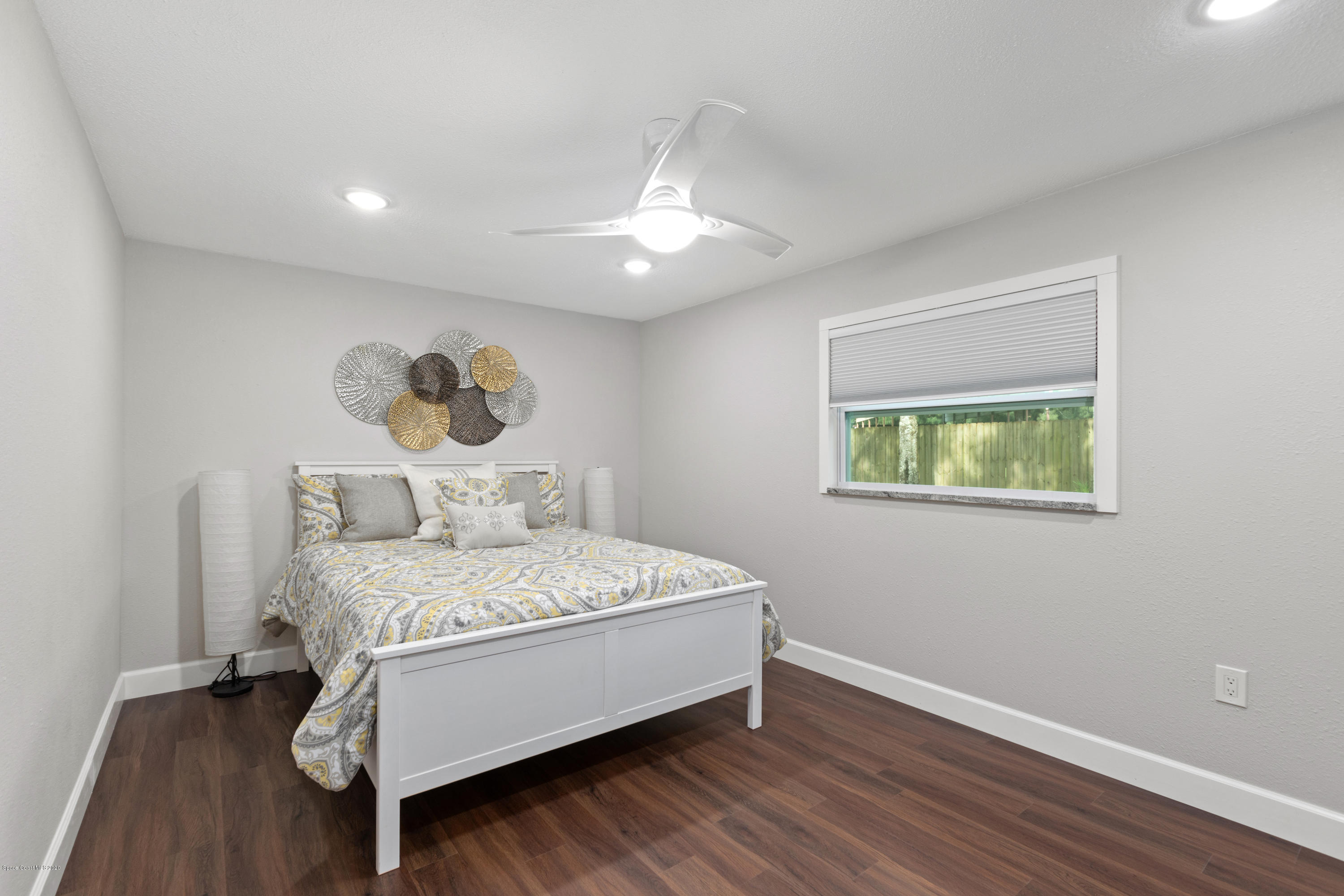 1790 Harlock Road Melbourne, FL 32934 - Photo 42 of 47 a bed sitting in a spacious bedroom next to a window