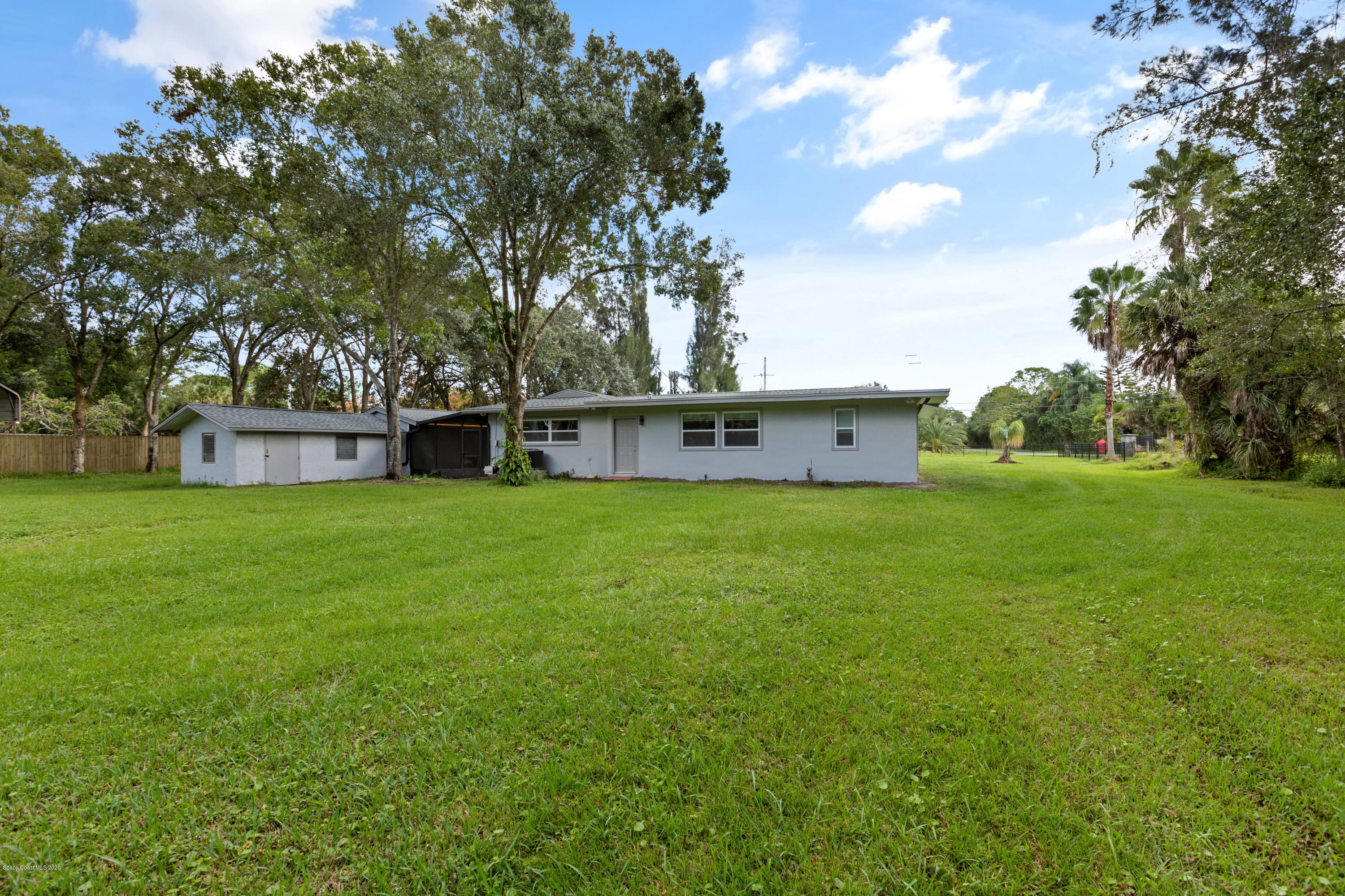 1790 Harlock Road Melbourne, FL 32934 - Photo 46 of 47 a house view with swimming pool in front of it