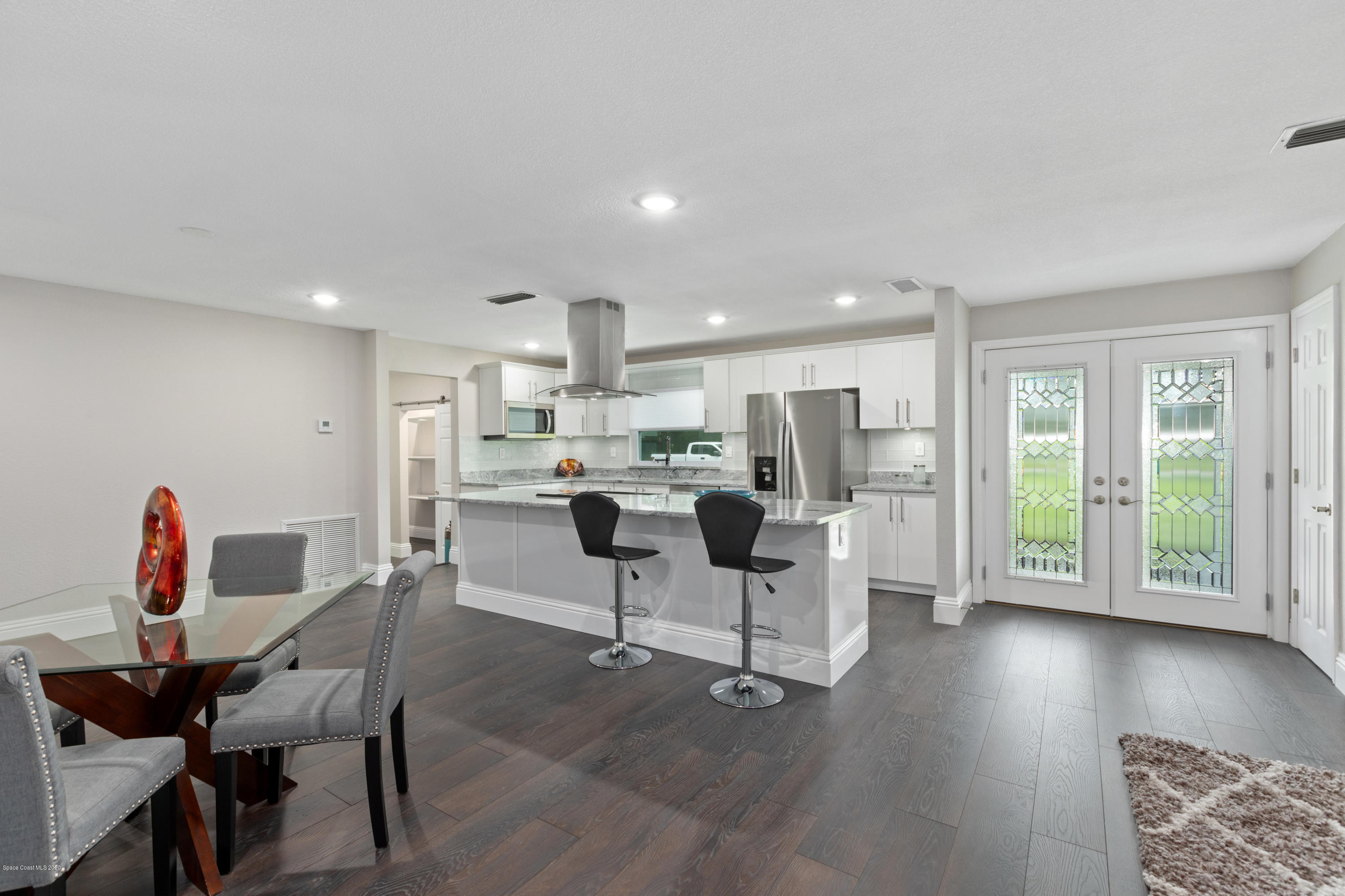 1790 Harlock Road Melbourne, FL 32934 - Photo 9 of 47 a view of a dining room with furniture and wooden floor