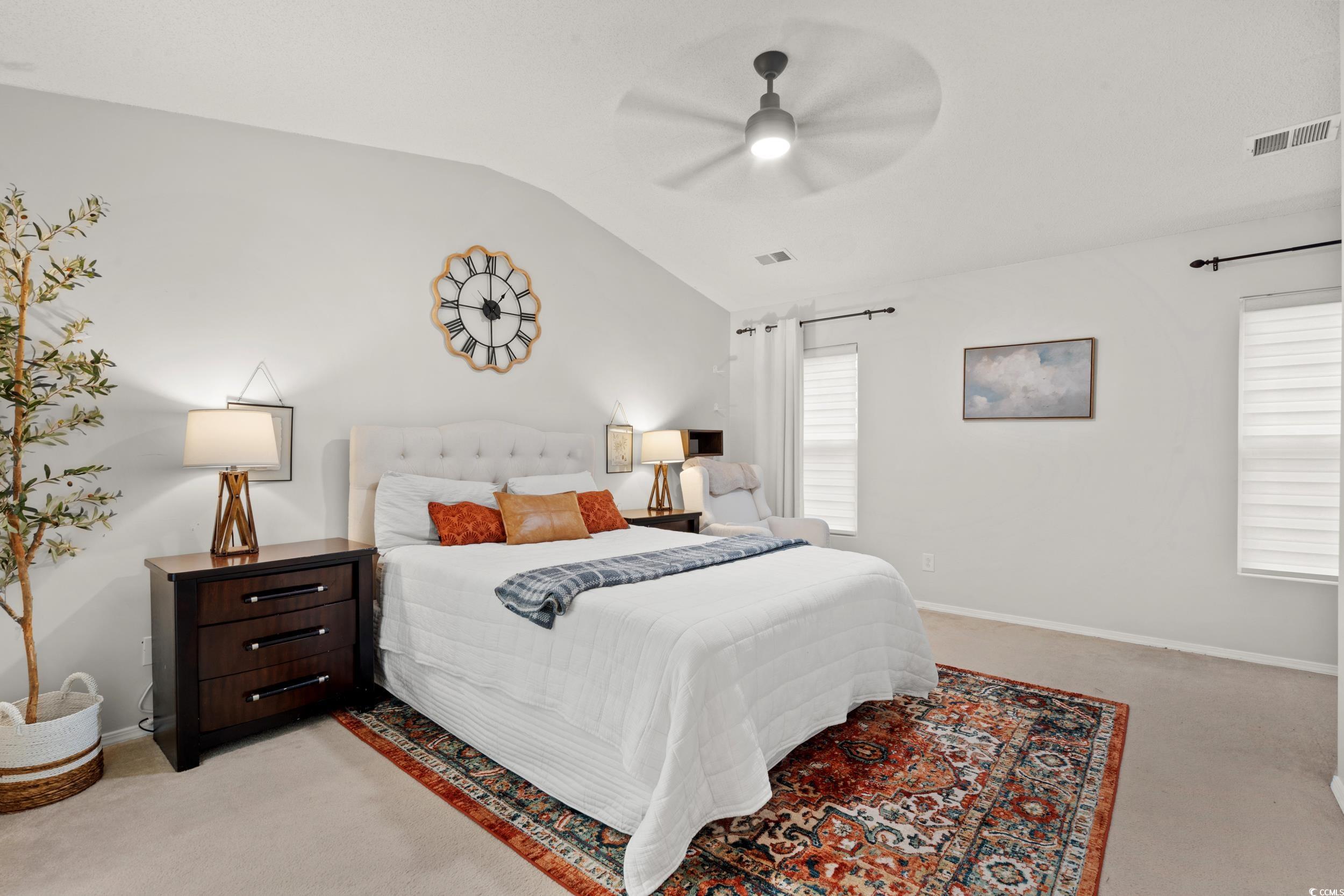 104 Olde Towne Way, Unit 5 Myrtle Beach, SC 29588 - Photo 17 of 24 Bedroom with light colored carpet, lofted ceiling, and ceiling fan