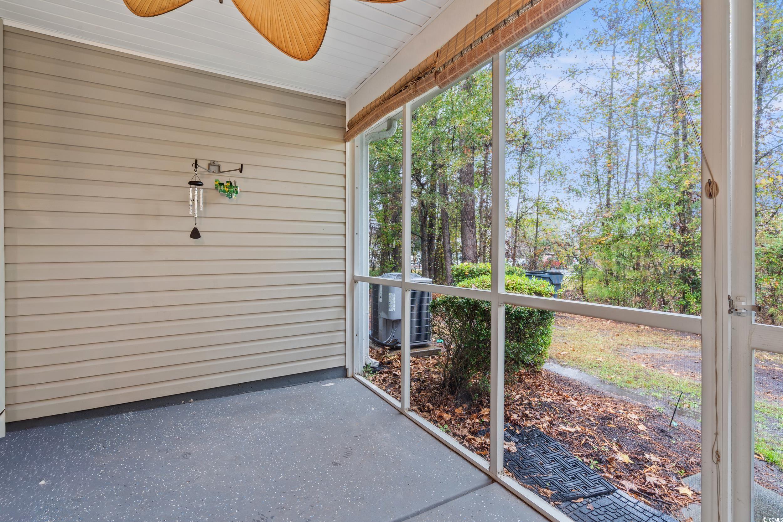 104 Olde Towne Way, Unit 5 Myrtle Beach, SC 29588 - Photo 22 of 24 Unfurnished sunroom with a ceiling fan
