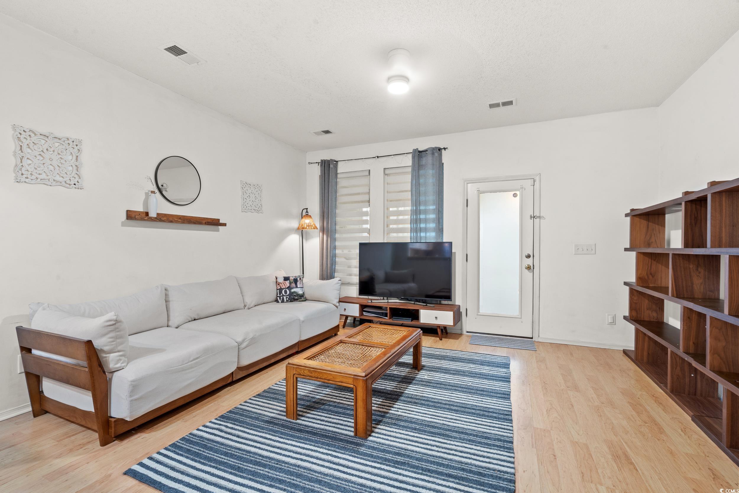 104 Olde Towne Way, Unit 5 Myrtle Beach, SC 29588 - Photo 9 of 24 Living room with light wood-style flooring