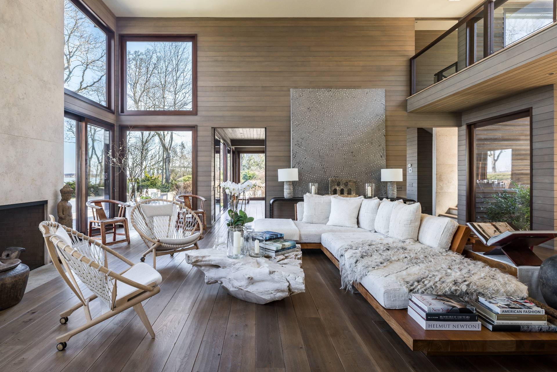 54 Hedges Banks Drive East Hampton, NY 11937 - Photo 2 of 24 a living room with furniture and floor to ceiling windows