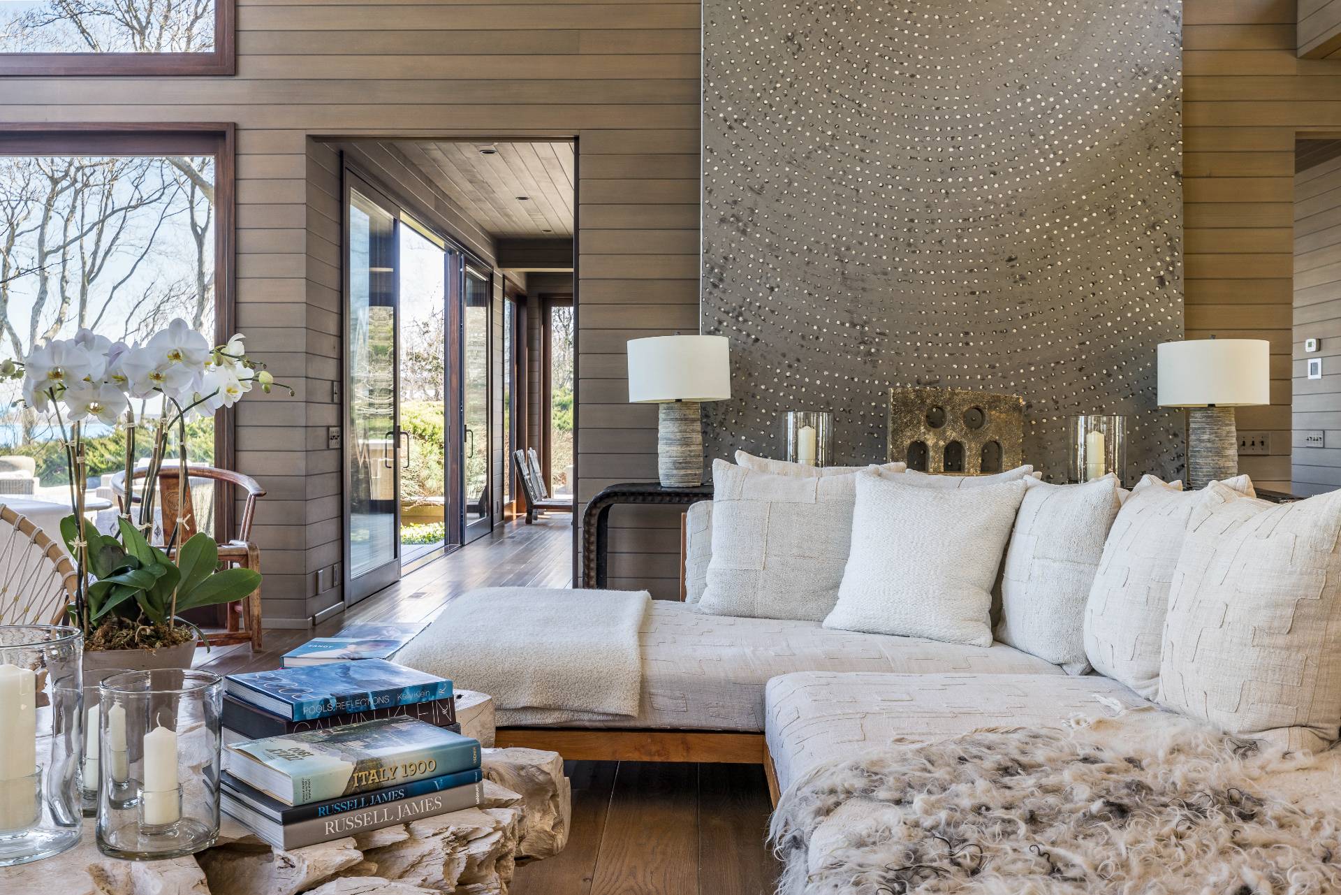 54 Hedges Banks Drive East Hampton, NY 11937 - Photo 3 of 24 a living room with a couch and a potted plant
