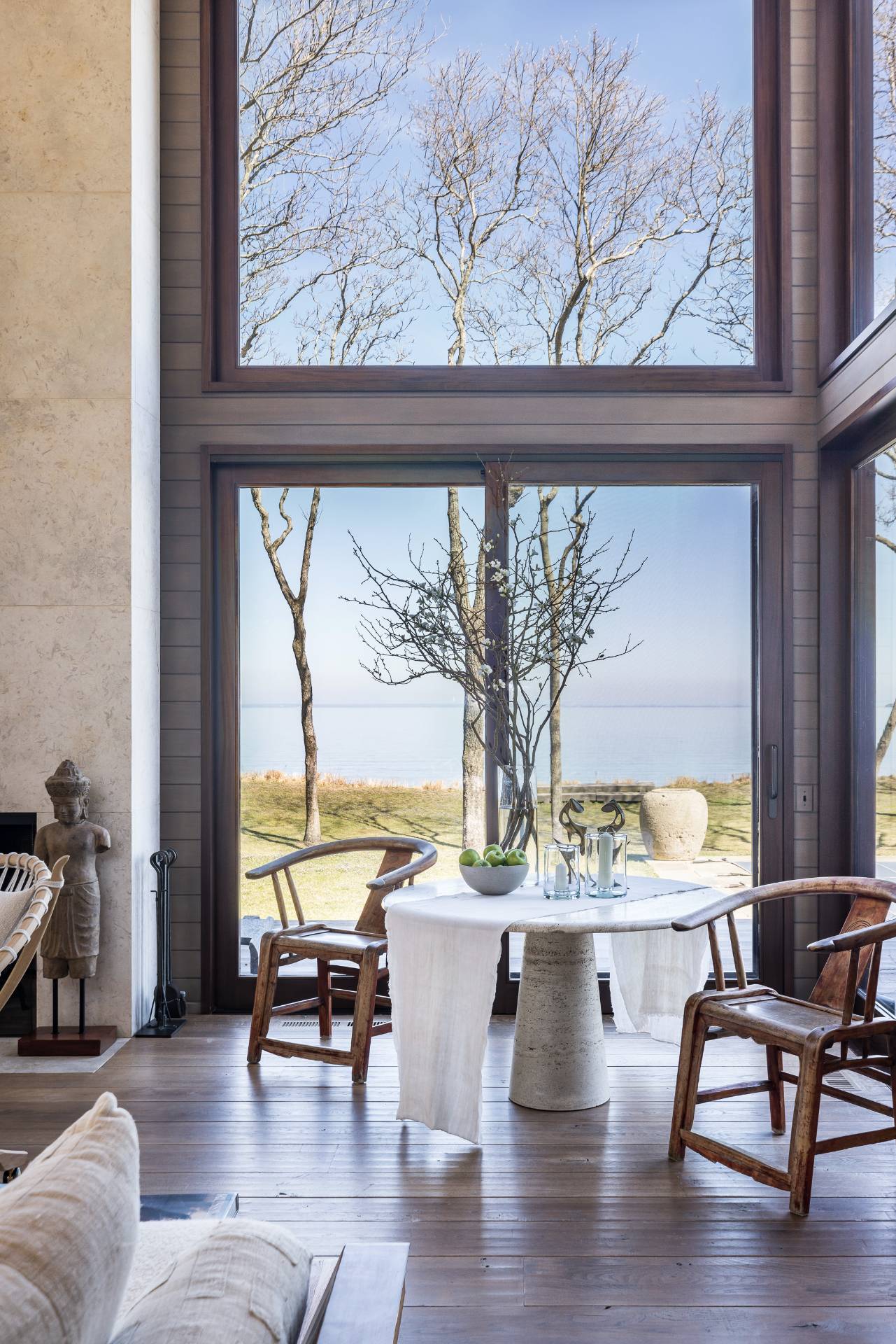 54 Hedges Banks Drive East Hampton, NY 11937 - Photo 8 of 24 a view of living room filled with furniture and floor to ceiling windows