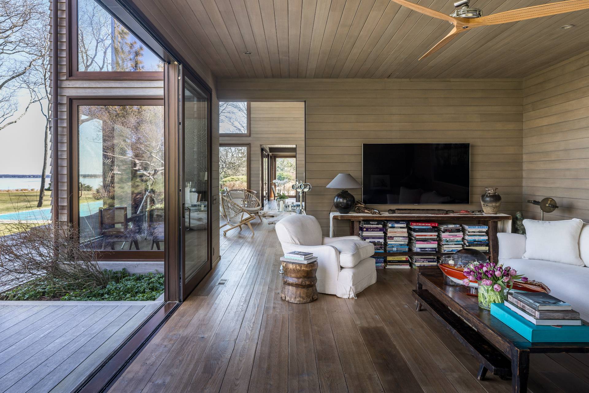 54 Hedges Banks Drive East Hampton, NY 11937 - Photo 10 of 24 a living room with furniture and a flat screen tv