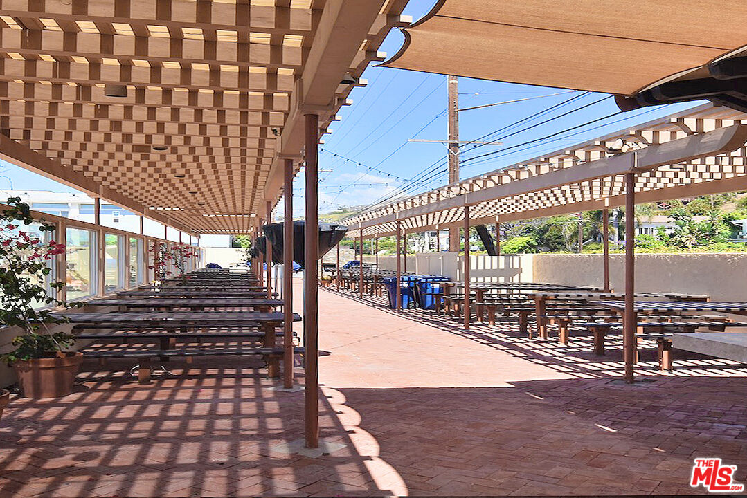 3833 Rambla Pacifico Street Malibu, CA 90265 - Photo 7 of 11 a view of a pathway with a building in the background