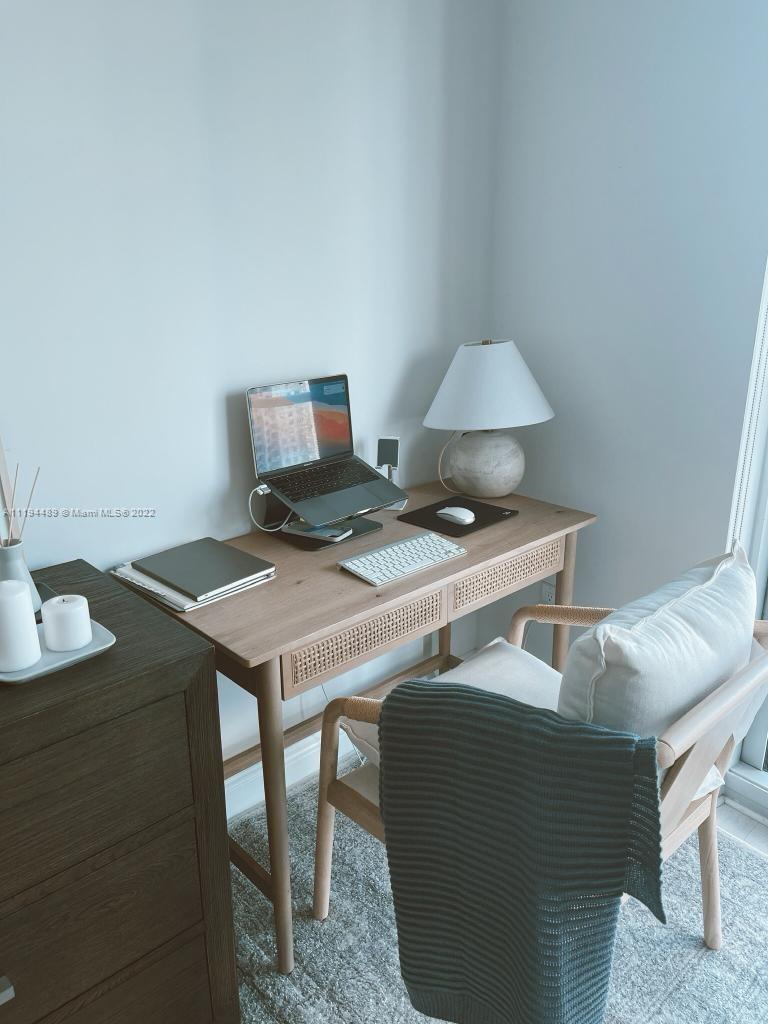 185 Southwest 7th Street, Unit 2703 Miami, FL 33130 - Photo 14 of 16 a view of a workspace with furniture