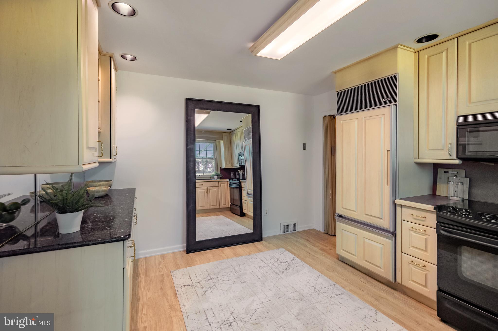 262 Ellis Road Havertown, PA 19083 - Photo 17 of 41 a kitchen with a refrigerator and microwave