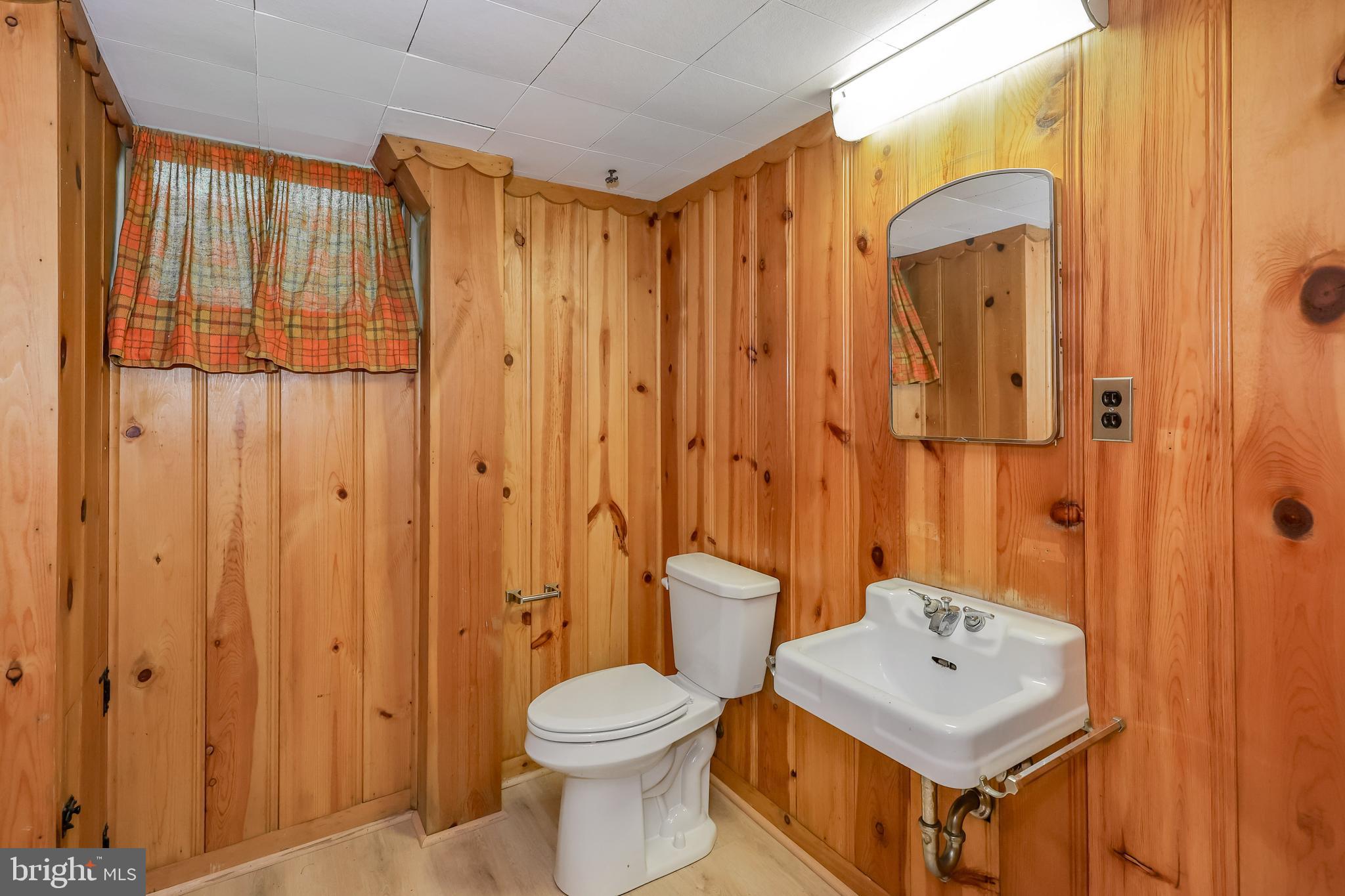 262 Ellis Road Havertown, PA 19083 - Photo 36 of 41 a bathroom with a toilet a sink and a shower curtain